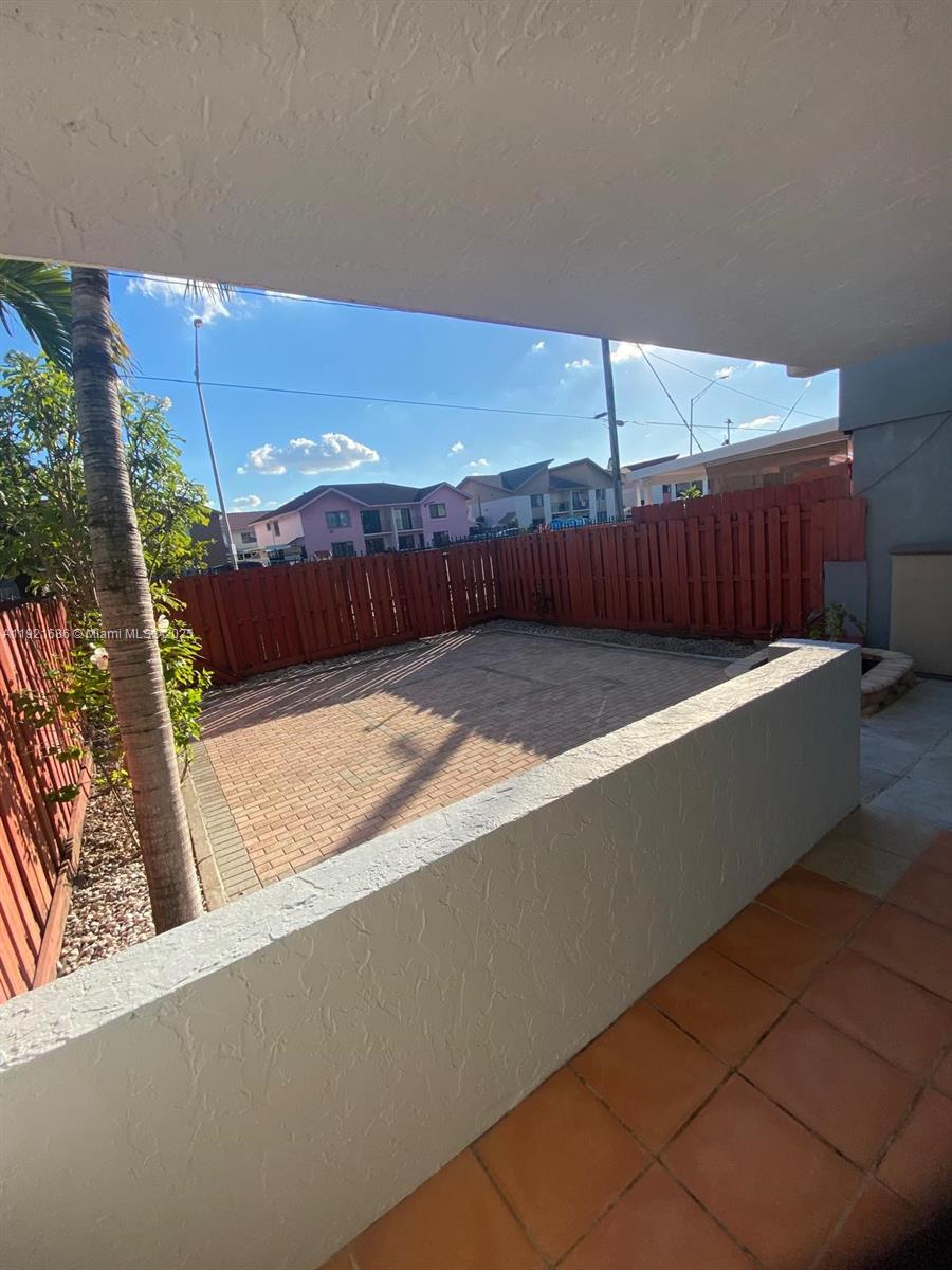 1725 West 60th Street, Unit F128 Hialeah, FL 33012 - Photo 15 of 21 a view of a backyard