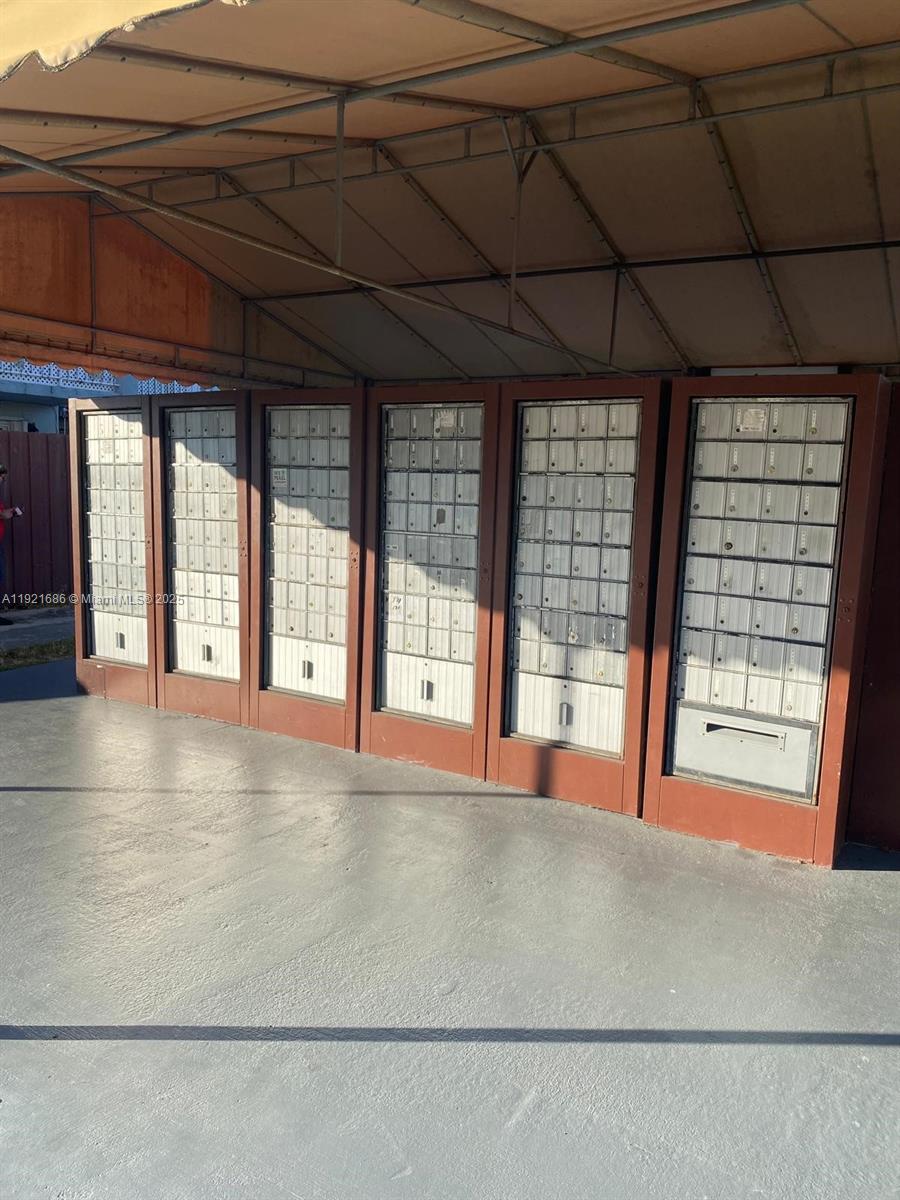 1725 West 60th Street, Unit F128 Hialeah, FL 33012 - Photo 20 of 21 a view of an empty room with a fireplace