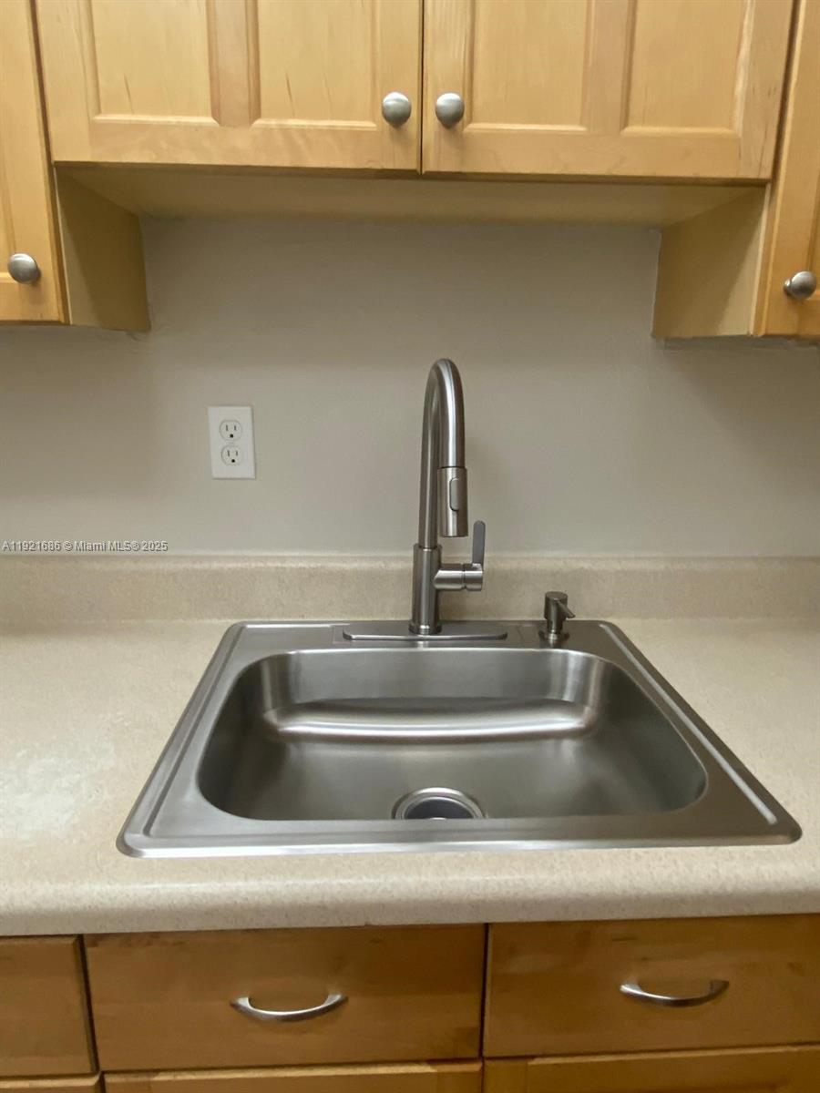 1725 West 60th Street, Unit F128 Hialeah, FL 33012 - Photo 5 of 21 a close view of sink and tap