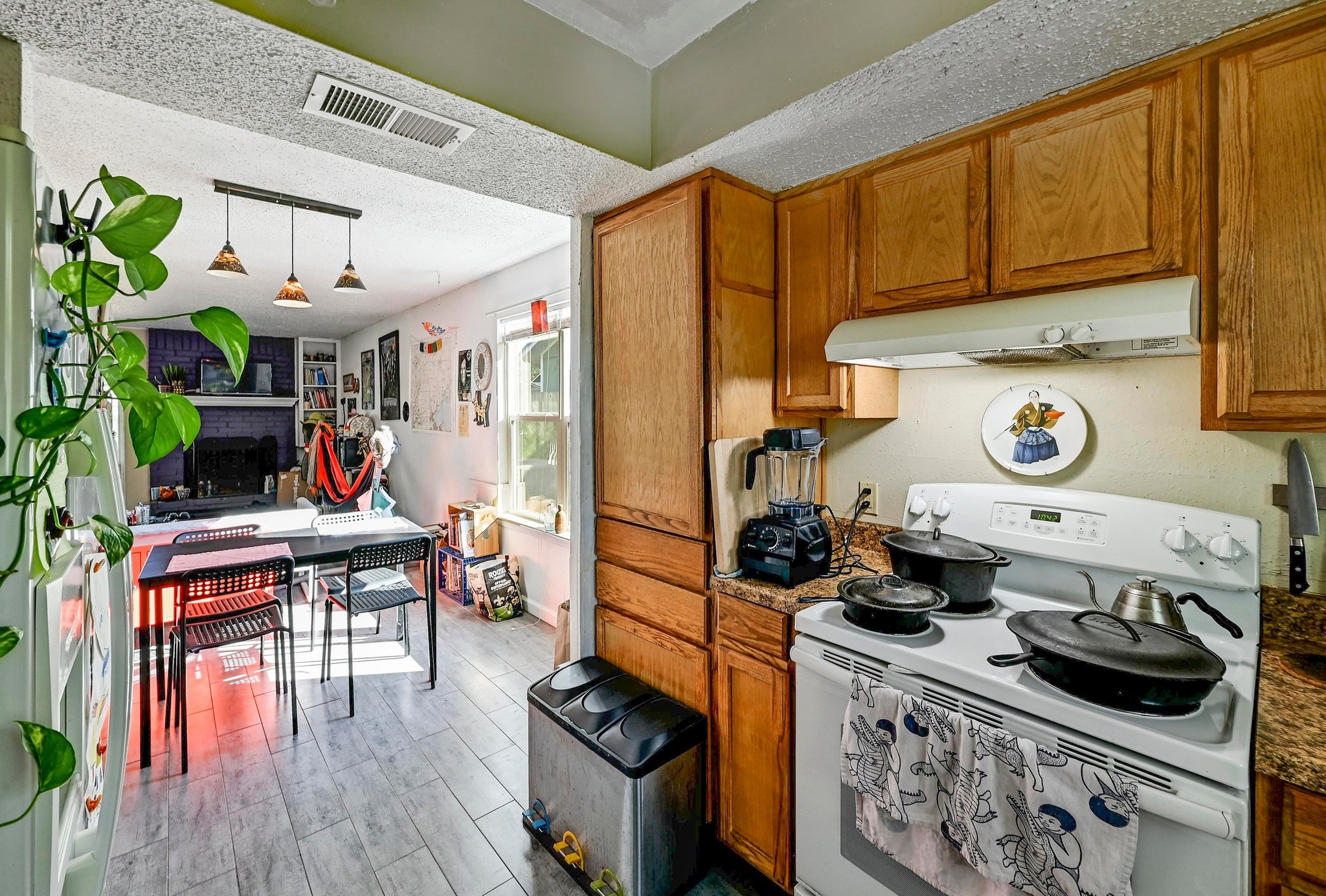 1208 Milford Way Austin, TX 78745 - Photo 11 of 22 a kitchen with stainless steel appliances granite countertop a stove and a wooden cabinets