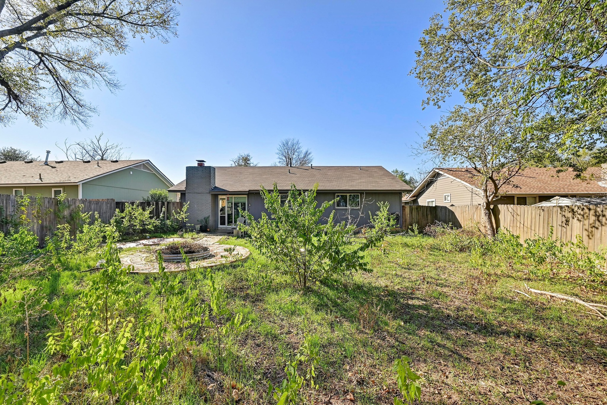 1208 Milford Way Austin, TX 78745 - Photo 20 of 22 a view of a house with a yard and sitting area