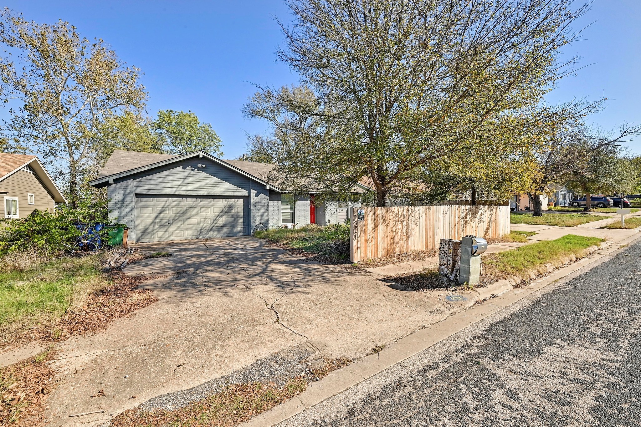 1208 Milford Way Austin, TX 78745 - Photo 2 of 22 a view of a house with backyard and trees