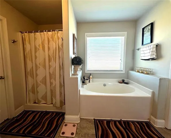 a bathroom with a sink and a bathtub