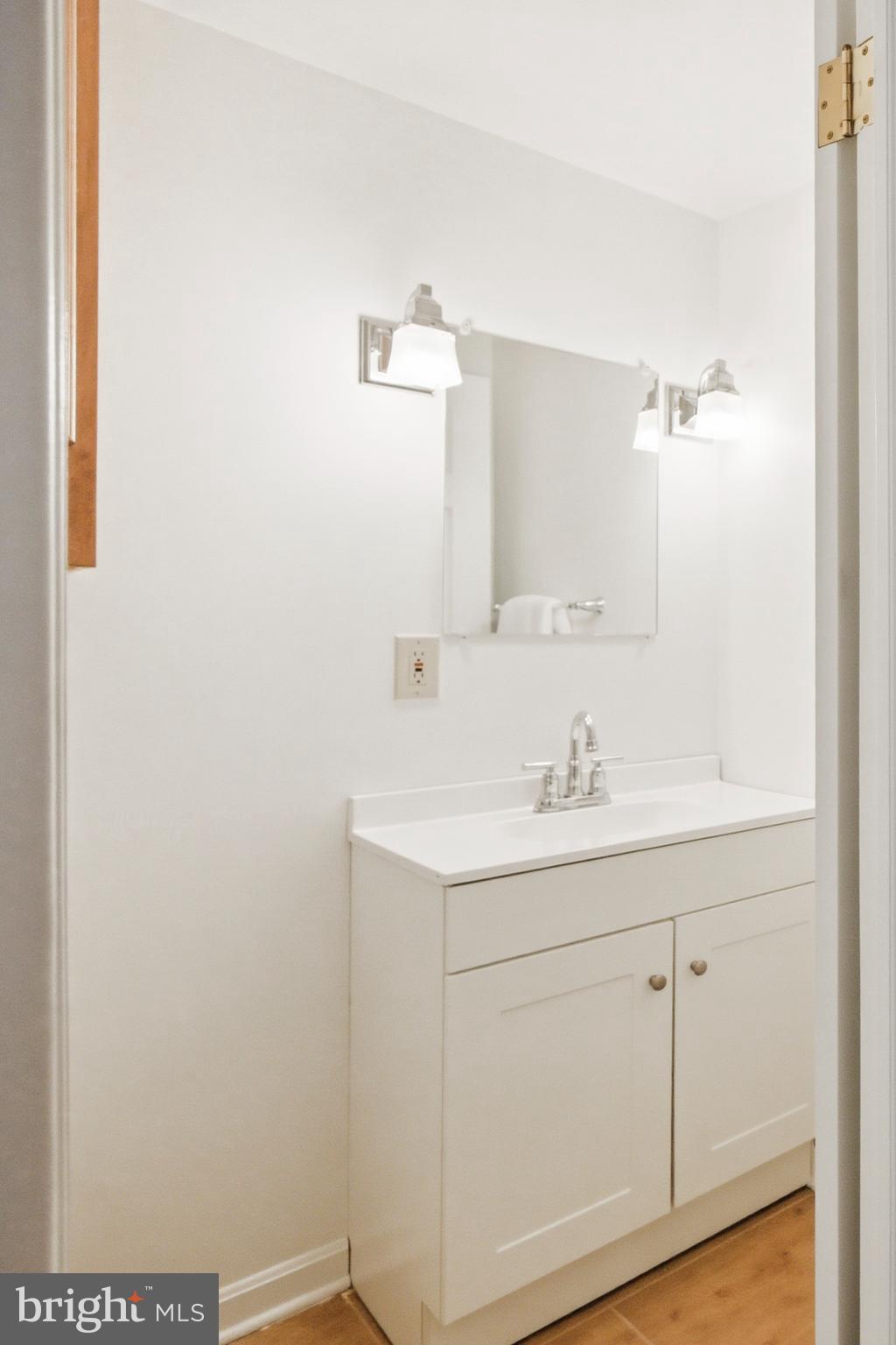 220 Solway Road Lutherville-Timonium, MD 21093 - Photo 21 of 38 a bathroom with a sink and a mirror