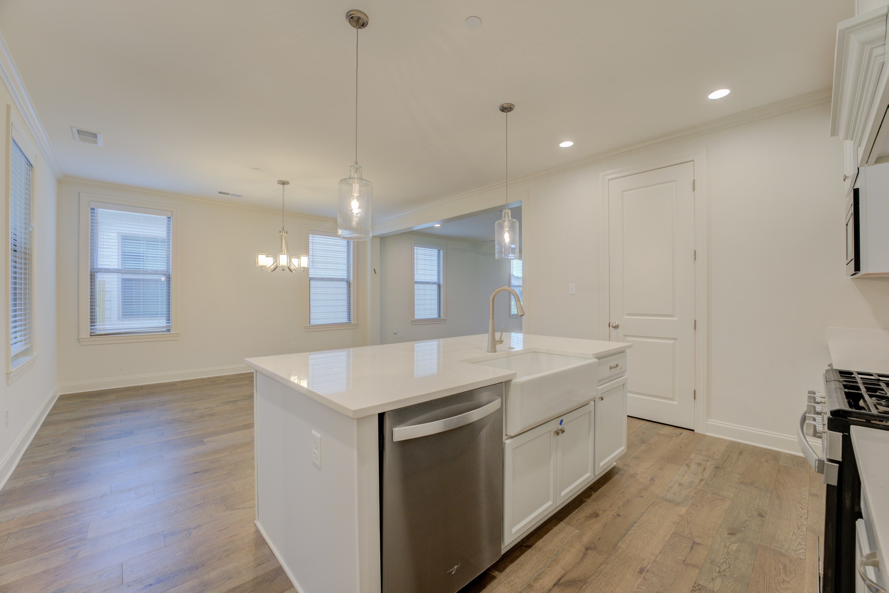 909 Ufton Alley Collierville, TN 38017 - Photo 11 of 29 a kitchen with a sink dishwasher a stove and a refrigerator with wooden floor