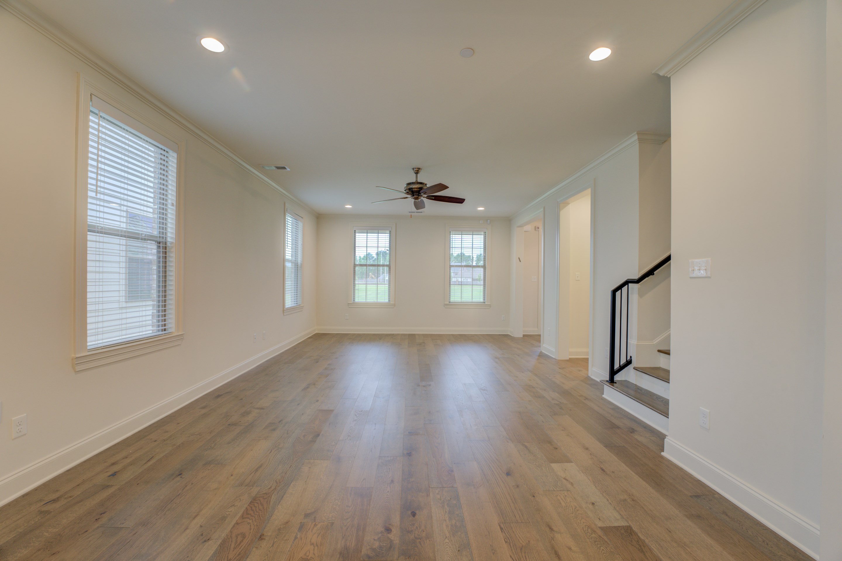 909 Ufton Alley Collierville, TN 38017 - Photo 12 of 29 an empty room with wooden floor and windows
