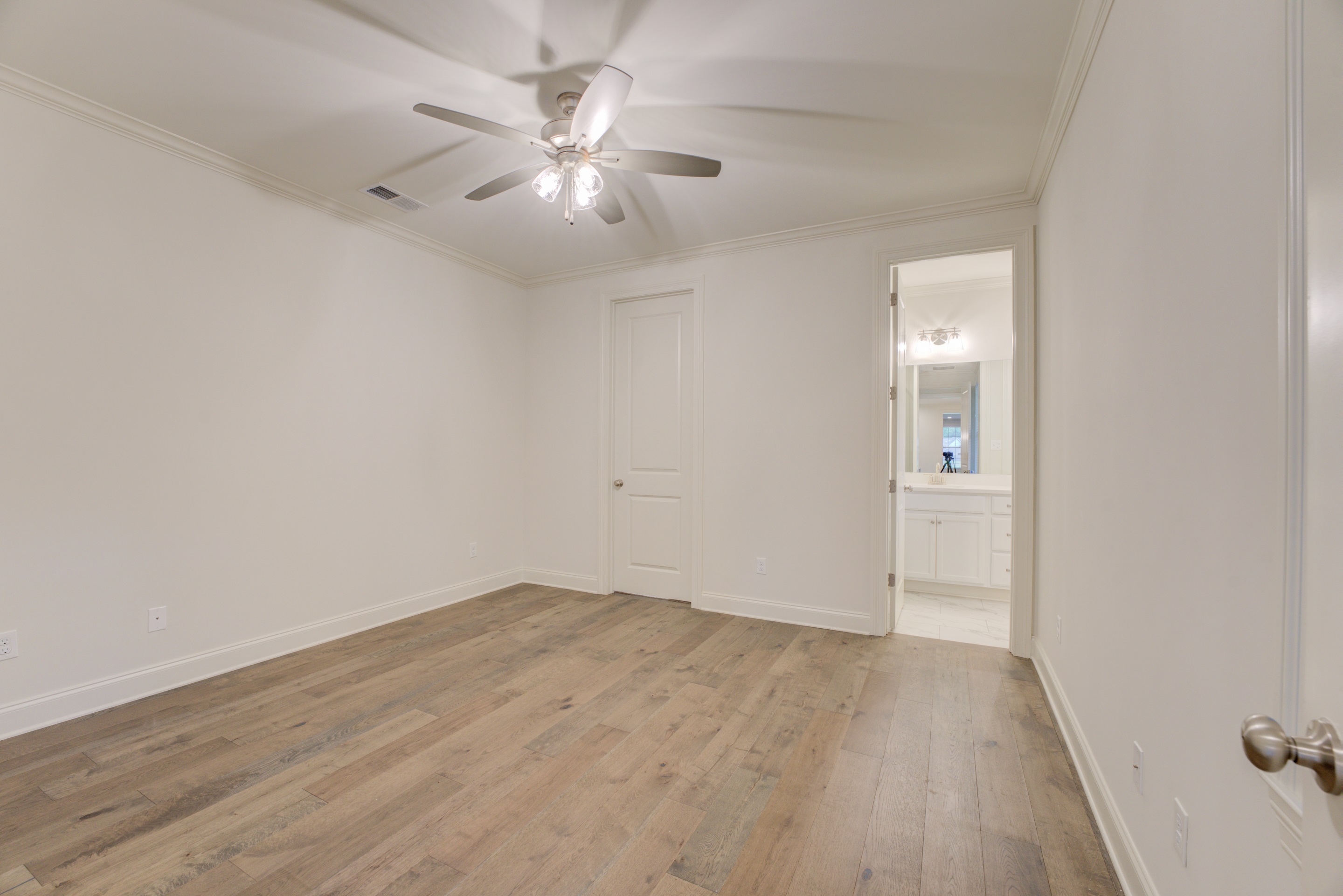 909 Ufton Alley Collierville, TN 38017 - Photo 16 of 29 an empty room with wooden floor and fan