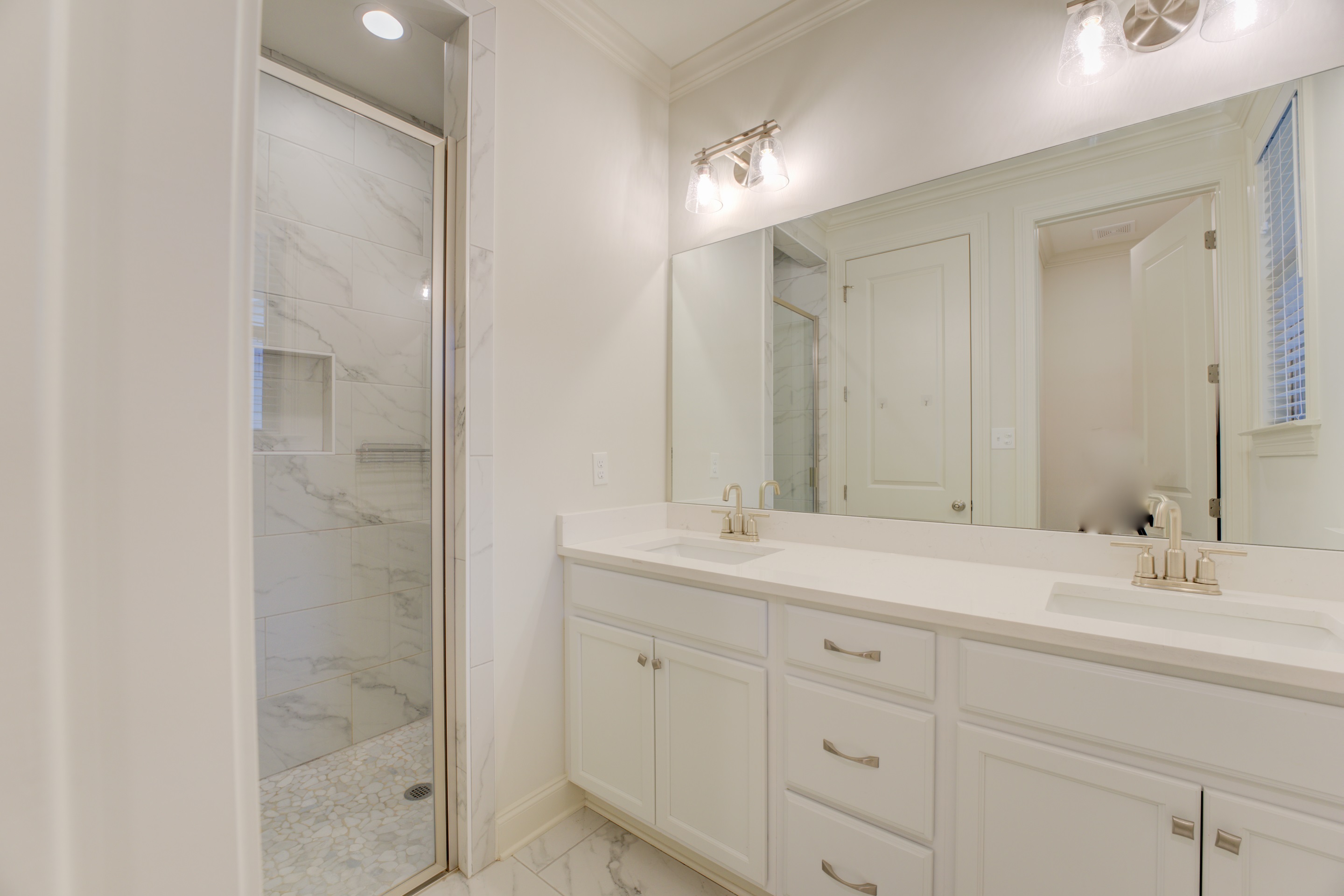 909 Ufton Alley Collierville, TN 38017 - Photo 17 of 29 a bathroom with a shower sink and mirror