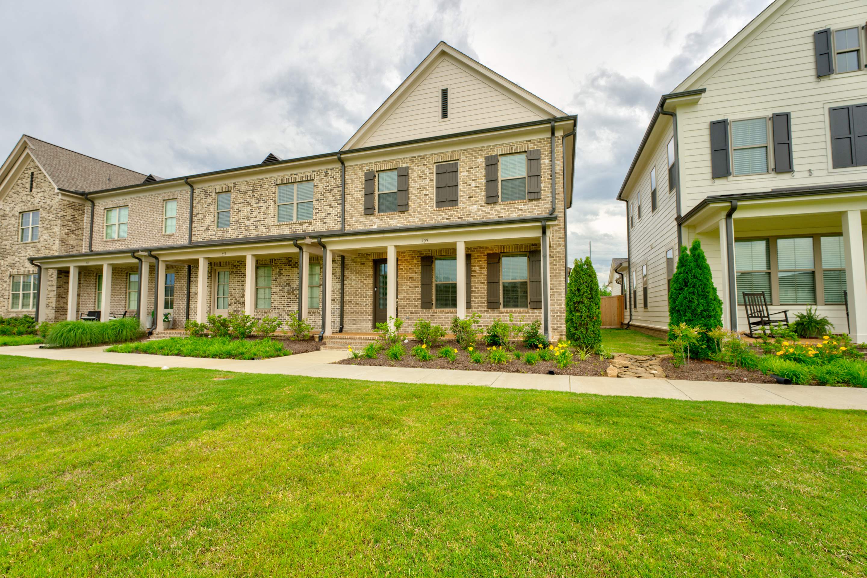 909 Ufton Alley Collierville, TN 38017 - Photo 2 of 29 front view of a brick house with a yard