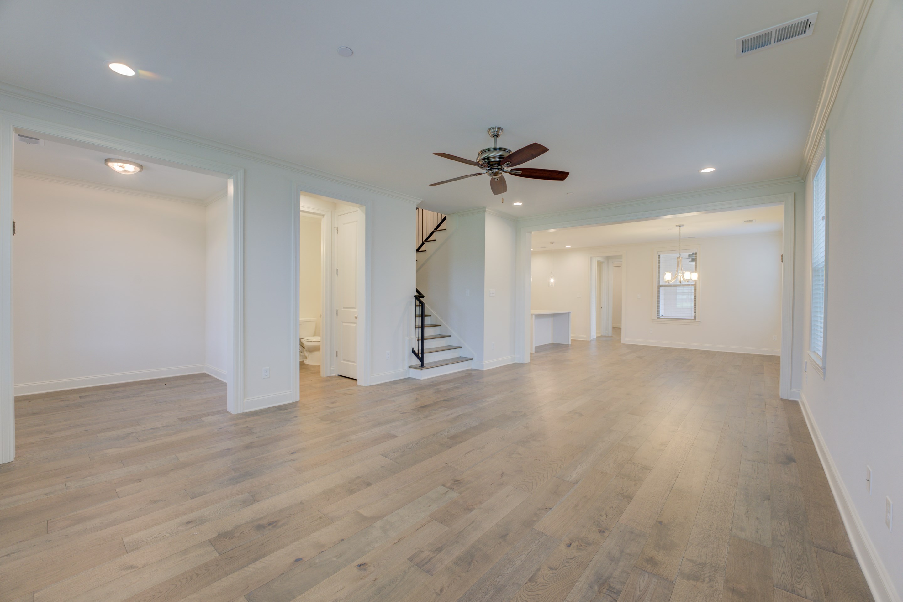 909 Ufton Alley Collierville, TN 38017 - Photo 29 of 29 a view of empty room with wooden floor and ceiling fan