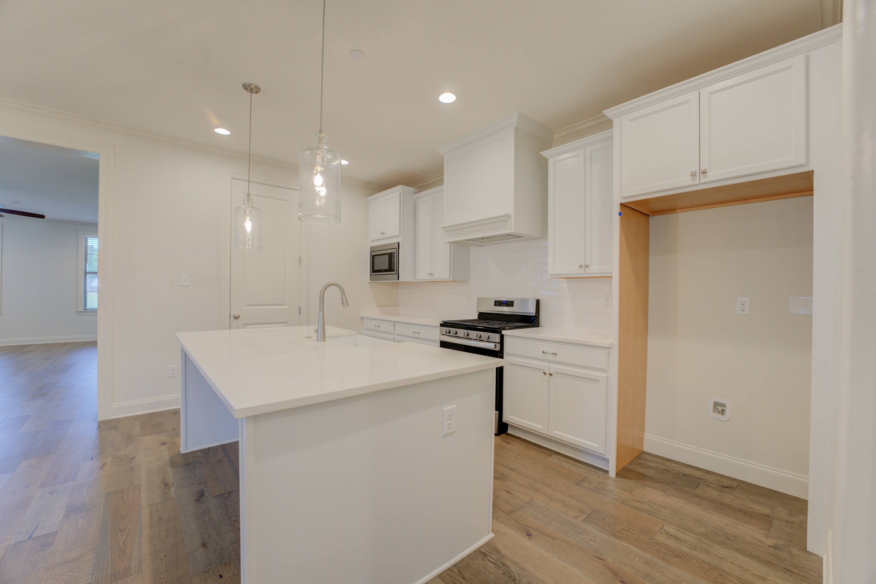 909 Ufton Alley Collierville, TN 38017 - Photo 5 of 29 a kitchen with a sink stainless steel appliances and cabinets