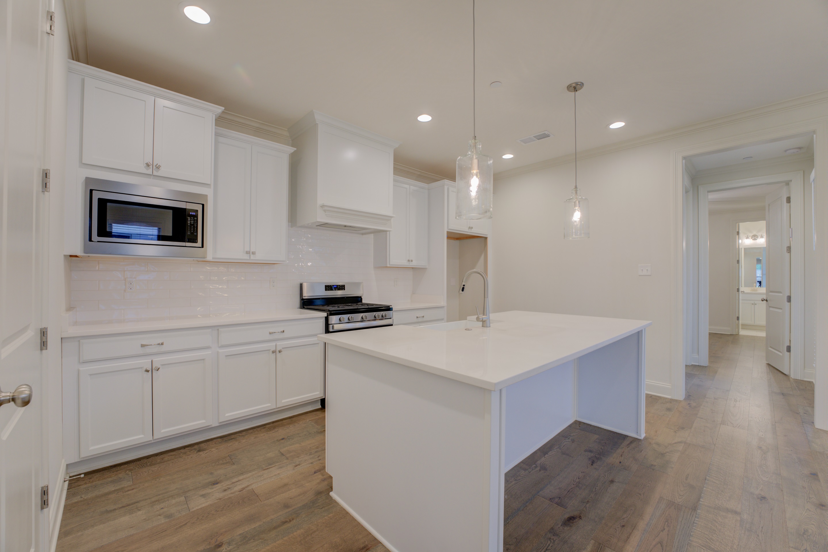 909 Ufton Alley Collierville, TN 38017 - Photo 10 of 29 a kitchen with stainless steel appliances a sink stove and cabinets