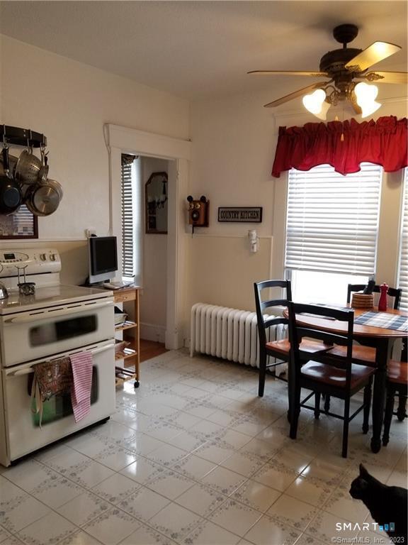 26 4th Street Hamden, CT 06514 - Photo 11 of 40 a kitchen with stainless steel appliances granite countertop a stove a sink and a microwave