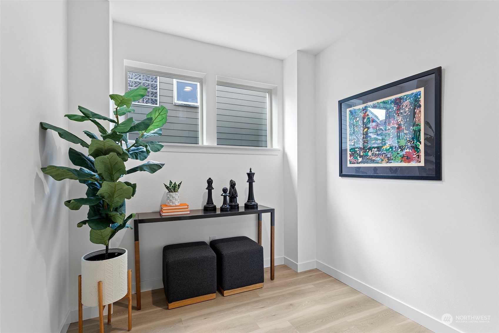 1424 18th Avenue Seattle, WA 98122 - Photo 13 of 29 a view of a workspace with furniture and a potted plant
