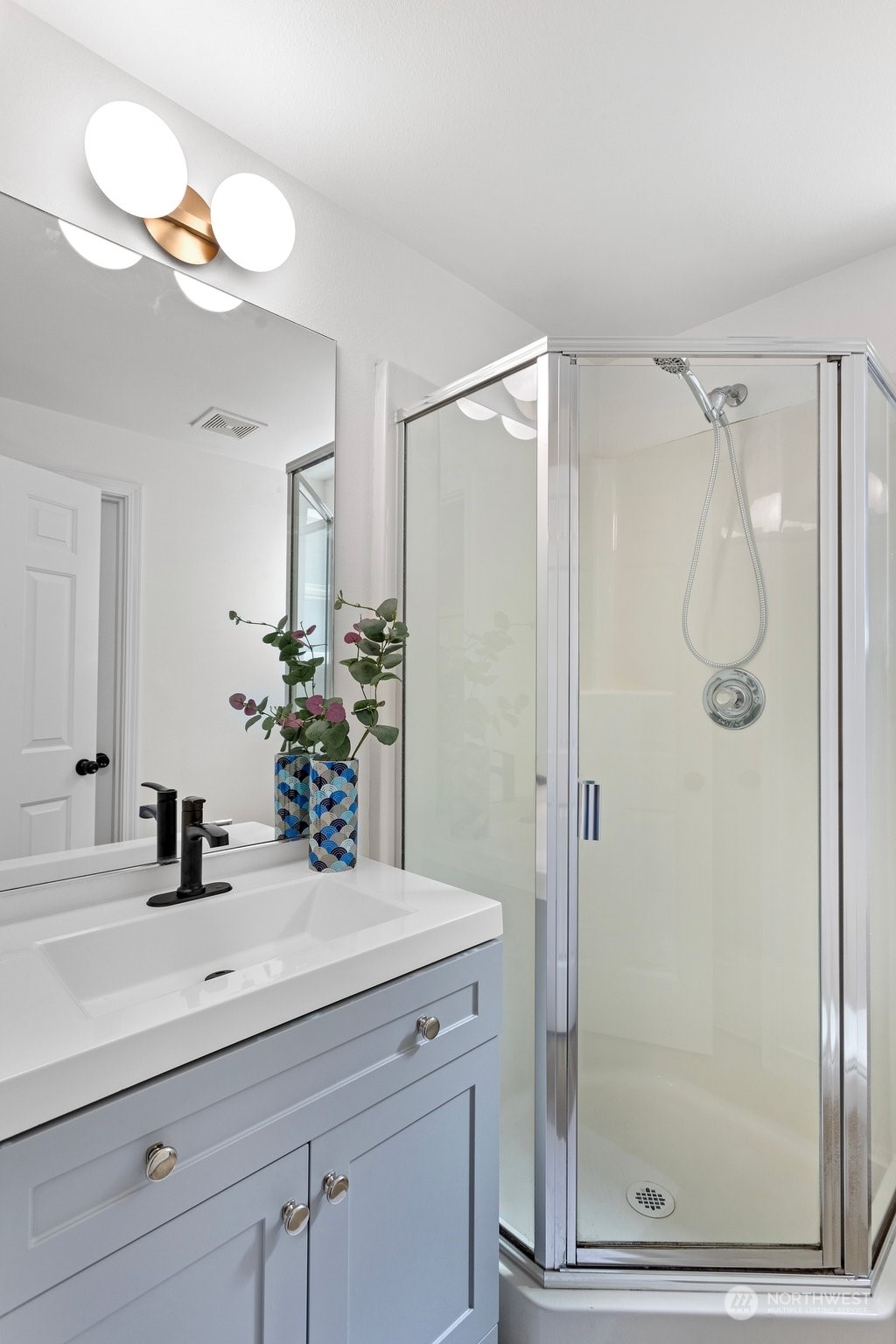 1424 18th Avenue Seattle, WA 98122 - Photo 19 of 29 a bathroom with a shower sink and mirror