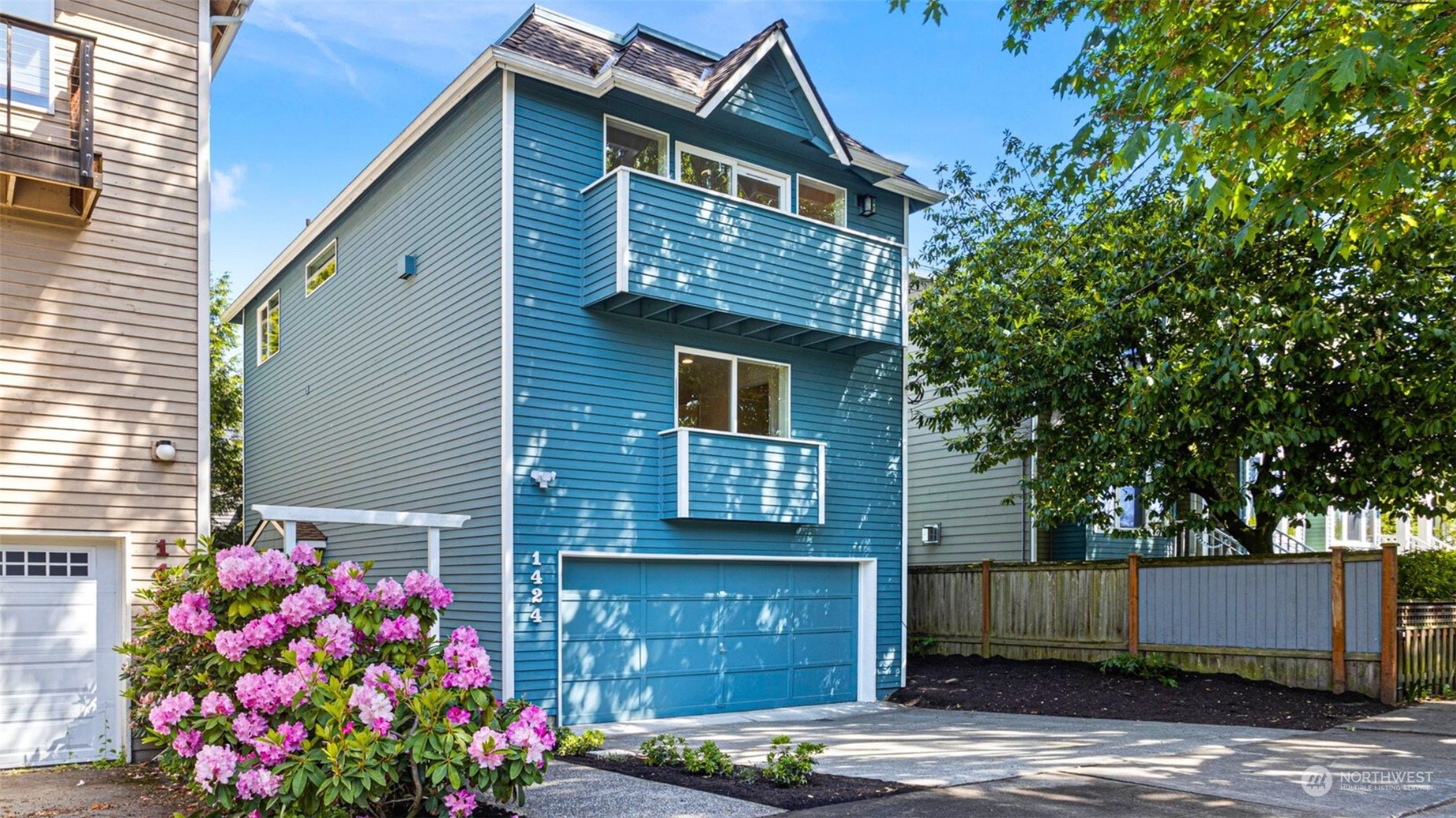 1424 18th Avenue Seattle, WA 98122 - Photo 2 of 29 a front view of house with flowers