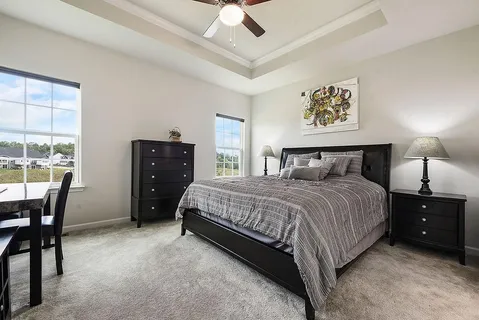 a bedroom with a bed and a table