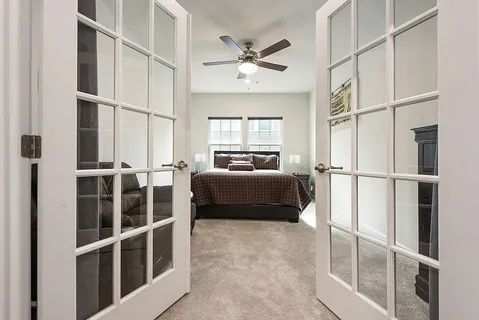 a bedroom with furniture and a window
