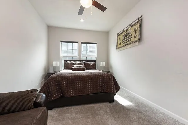 a bedroom with a bed and window