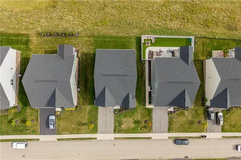 an aerial view of a house with a ocean view