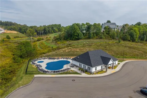 a view of a swimming pool with a yard
