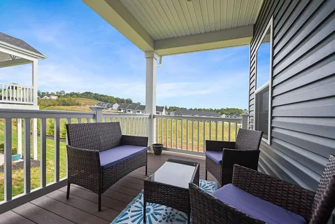 a roof deck with outdoor seating