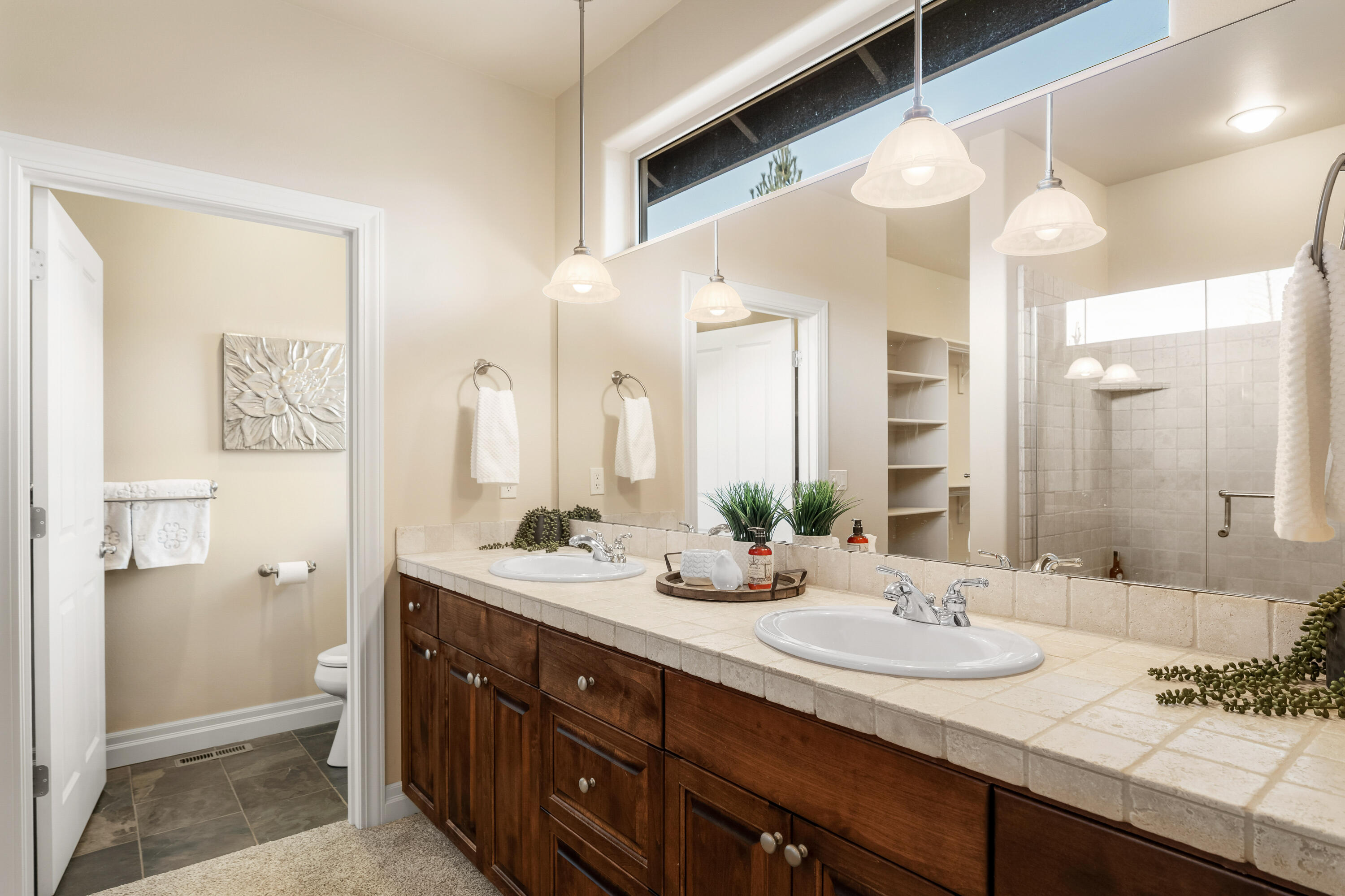 784 Ribbon Falls Road Redmond, OR 97756 - Photo 41 of 79 a bathroom with a granite countertop sink and a mirror