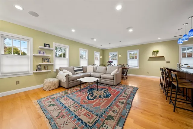 a living room with furniture and a rug