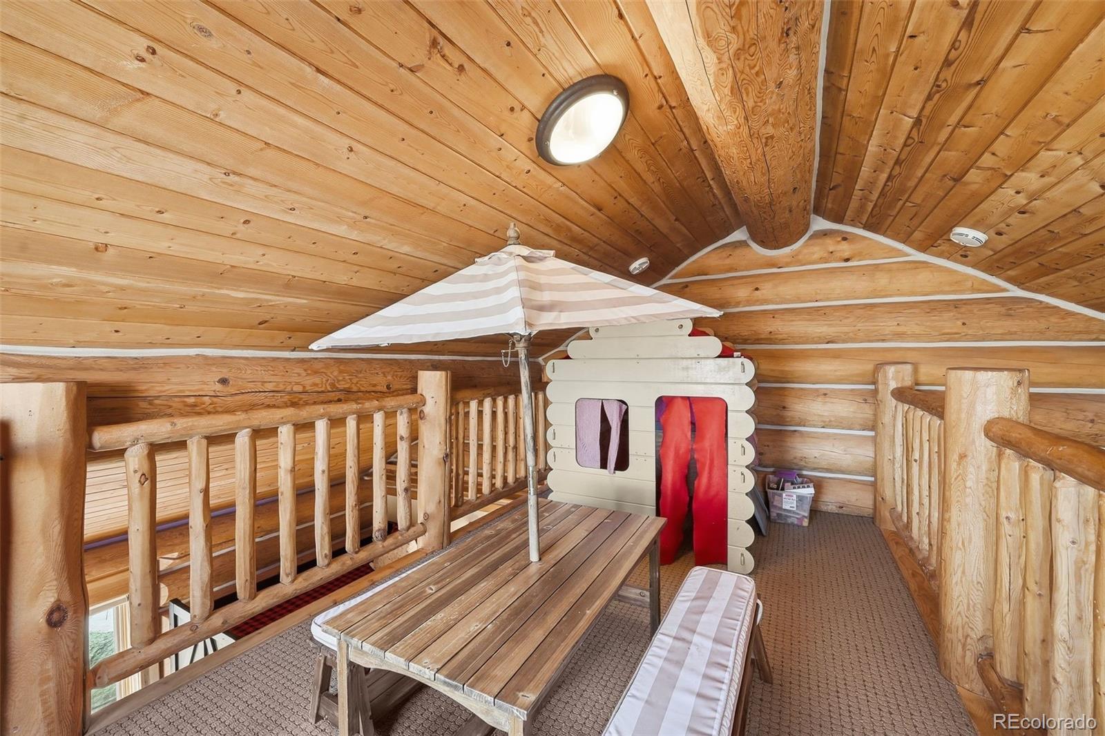 252 Iron Mountain Road Fairplay, CO 80440 - Photo 12 of 50 a view of a balcony with wooden floor