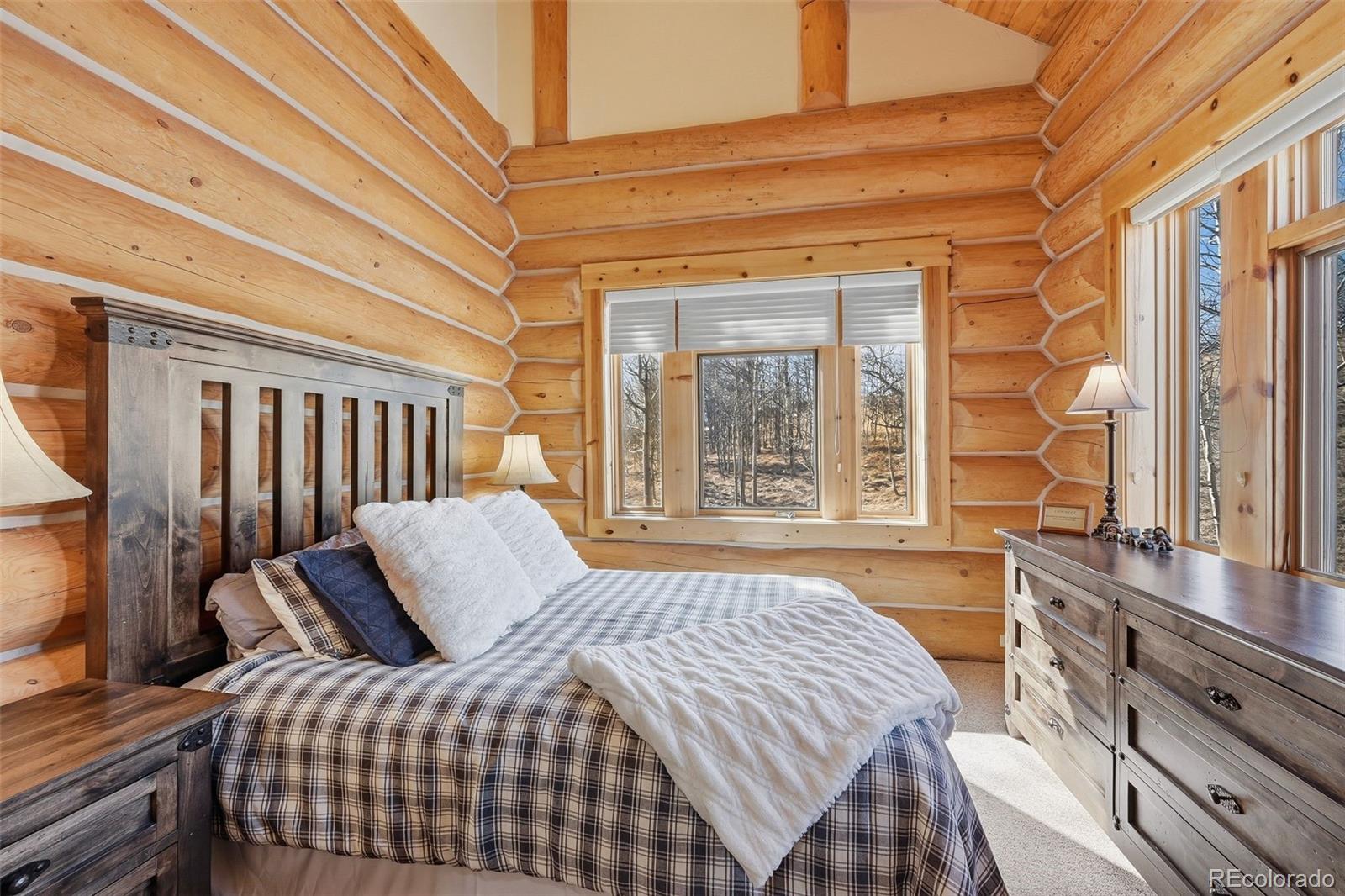 252 Iron Mountain Road Fairplay, CO 80440 - Photo 14 of 50 a bedroom with a bed and a window