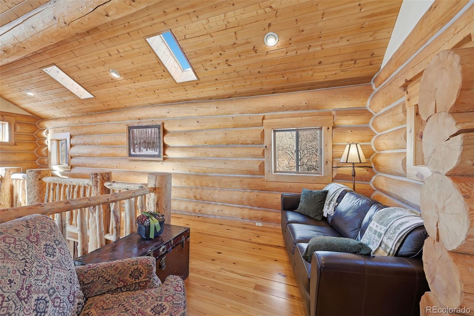 252 Iron Mountain Road Fairplay, CO 80440 - Photo 16 of 50 a living room with furniture and a flat screen tv