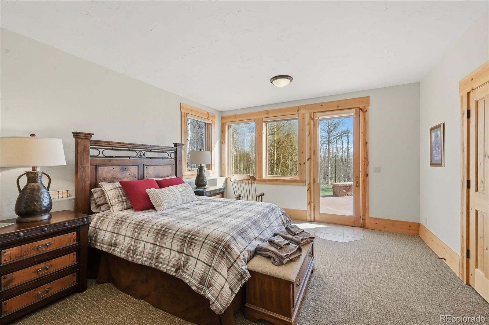 252 Iron Mountain Road Fairplay, CO 80440 - Photo 24 of 50 a bedroom with a bed and wooden floor