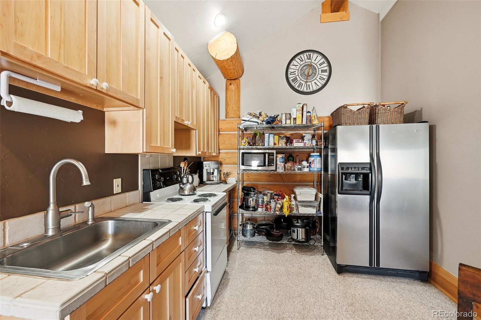 252 Iron Mountain Road Fairplay, CO 80440 - Photo 28 of 50 a kitchen with refrigerator and a sink