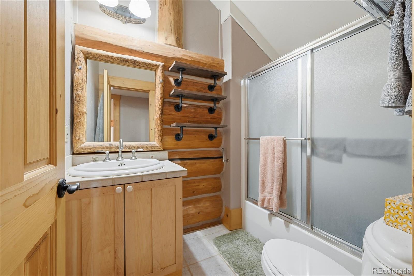 252 Iron Mountain Road Fairplay, CO 80440 - Photo 32 of 50 a bathroom with a sink toilet and shower