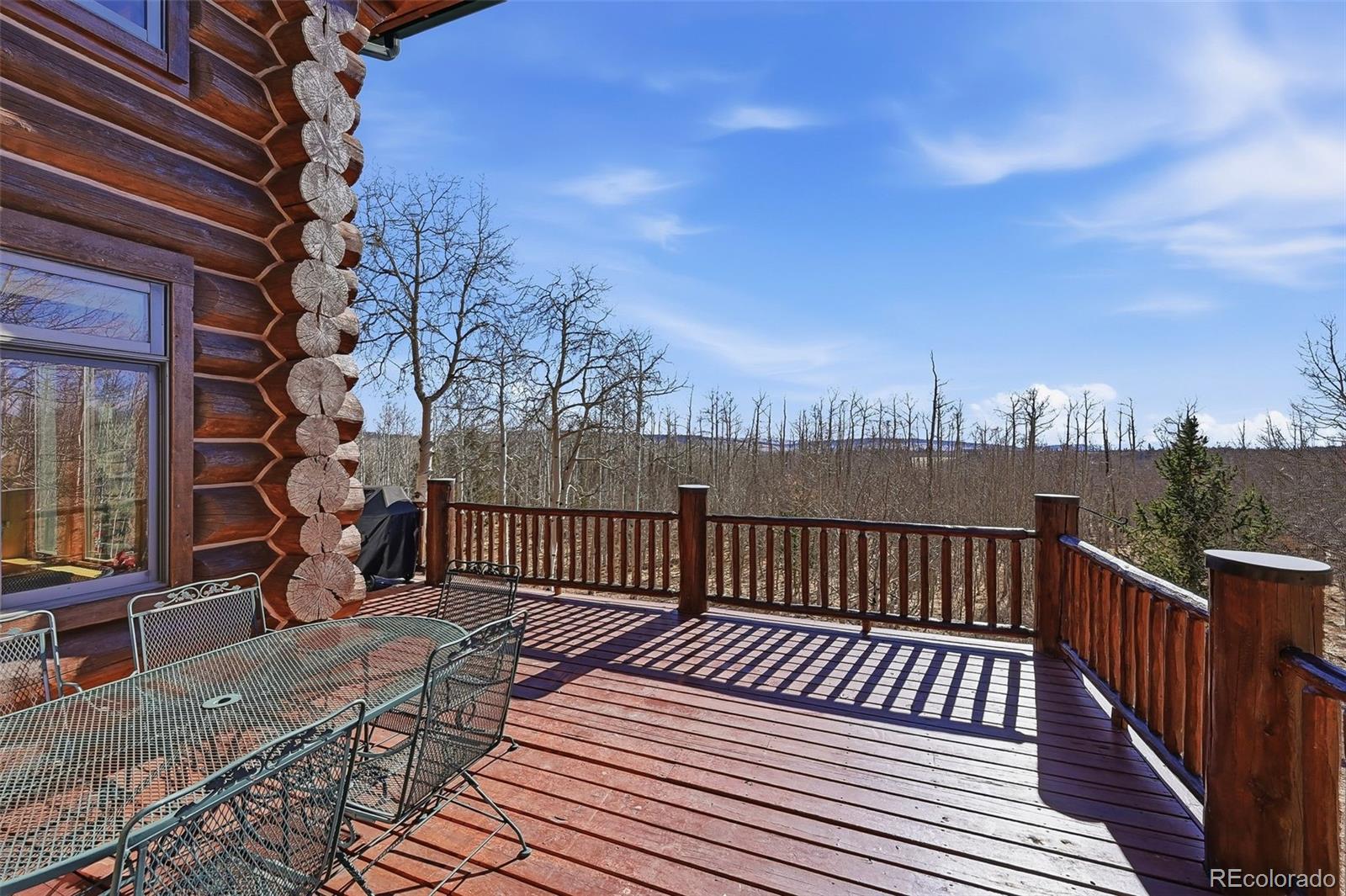 252 Iron Mountain Road Fairplay, CO 80440 - Photo 34 of 50 a view of a roof deck with wooden floor and fence