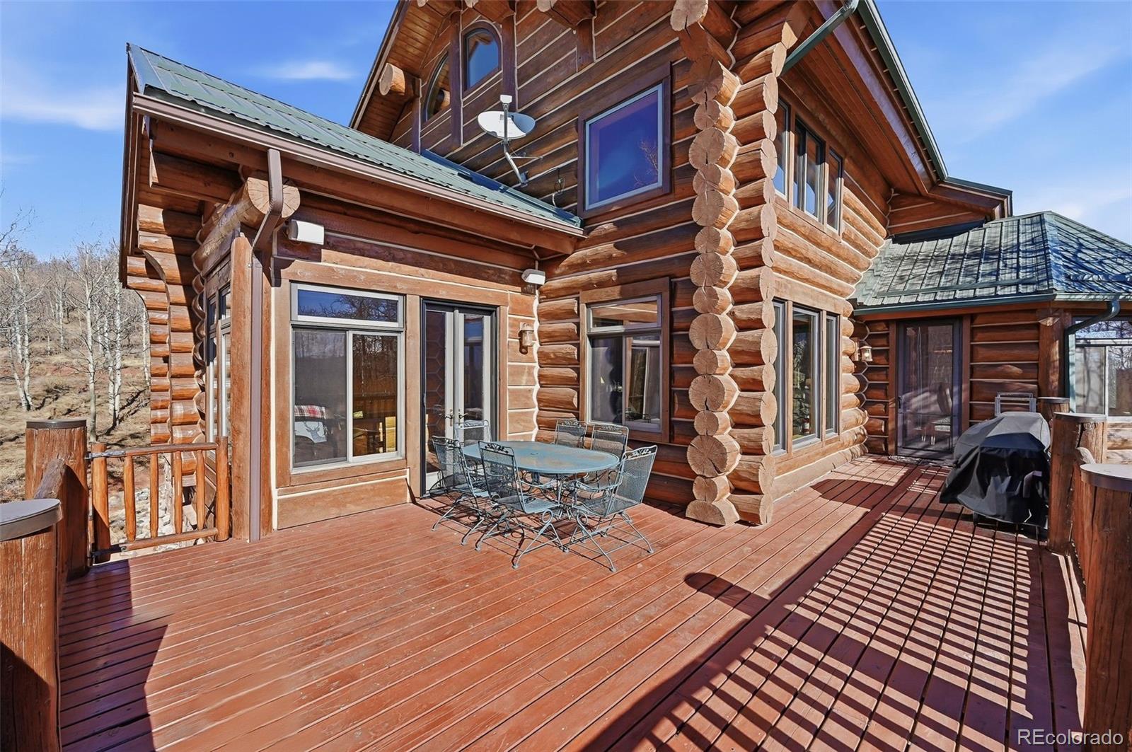 252 Iron Mountain Road Fairplay, CO 80440 - Photo 35 of 50 a view of a dinning table and chairs in the patio of the house