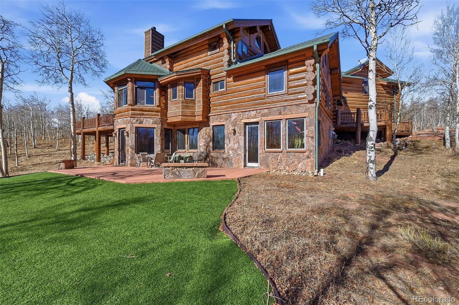 252 Iron Mountain Road Fairplay, CO 80440 - Photo 38 of 50 a front view of a house with garden and porch
