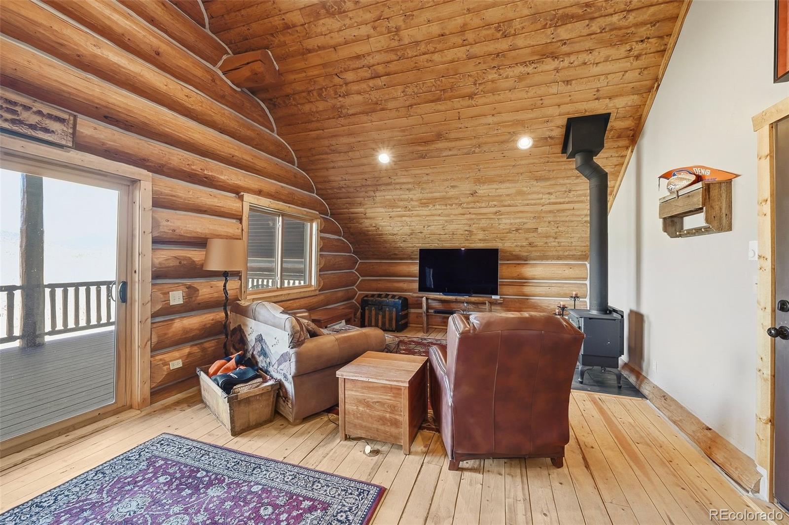 252 Iron Mountain Road Fairplay, CO 80440 - Photo 44 of 50 a living room with furniture and a flat screen tv