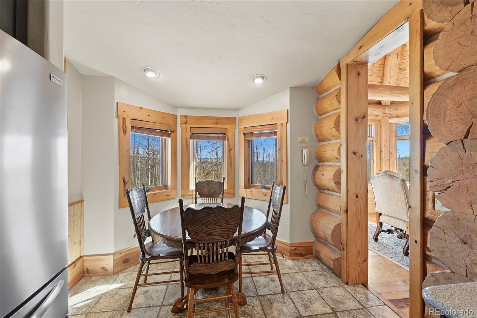252 Iron Mountain Road Fairplay, CO 80440 - Photo 8 of 50 a view of a dining room with furniture and a window