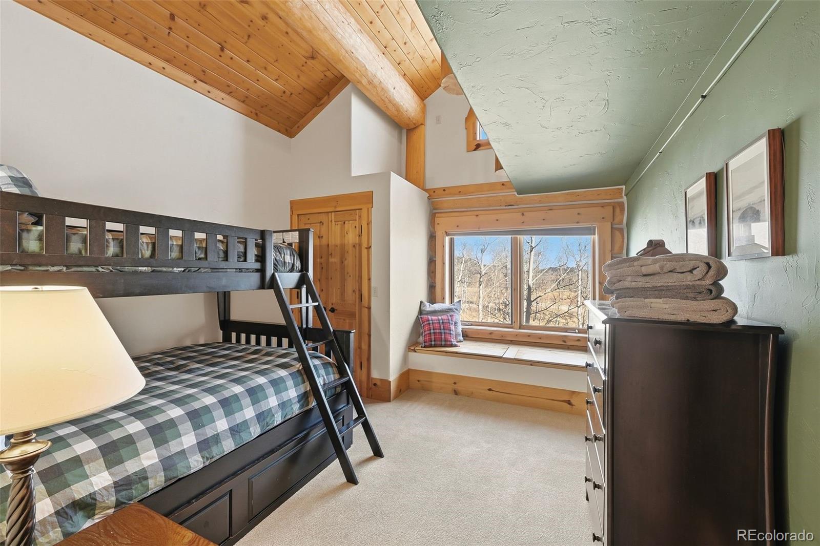 252 Iron Mountain Road Fairplay, CO 80440 - Photo 10 of 50 a bedroom with furniture and a large window