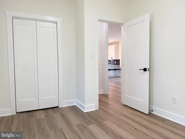 a bedroom with bed and a window