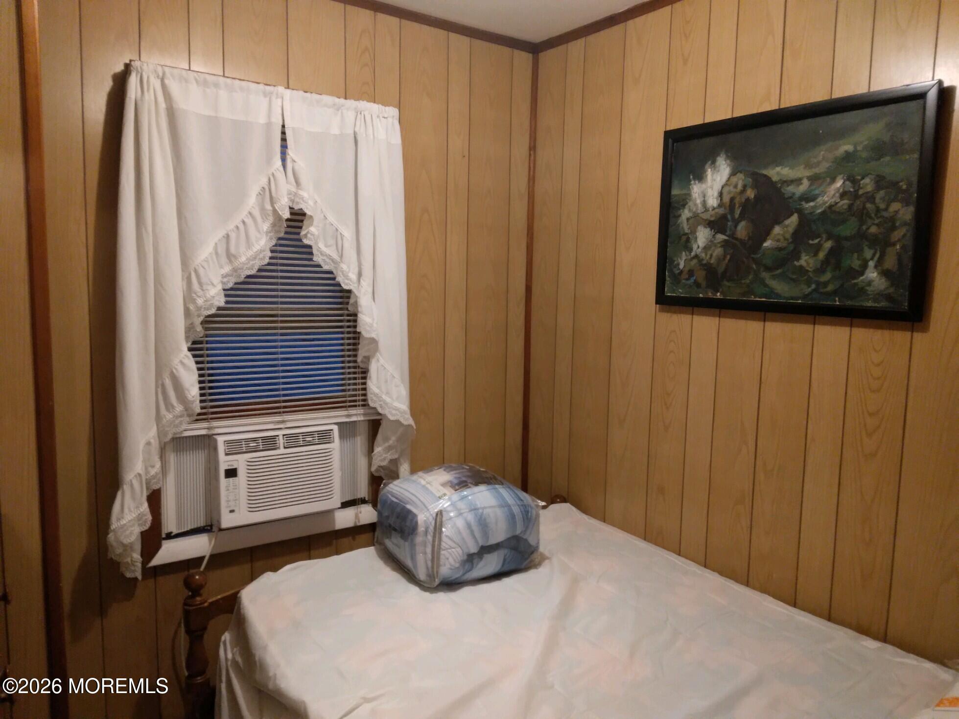 10 Lake Street Point Pleasant Beach, NJ 08742 - Photo 14 of 20 a bedroom with a bed and a painting on the wall