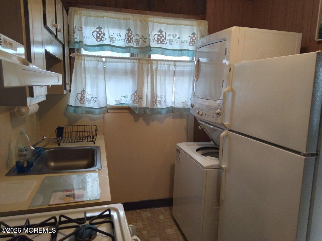 10 Lake Street Point Pleasant Beach, NJ 08742 - Photo 2 of 20 a kitchen with a refrigerator and a sink