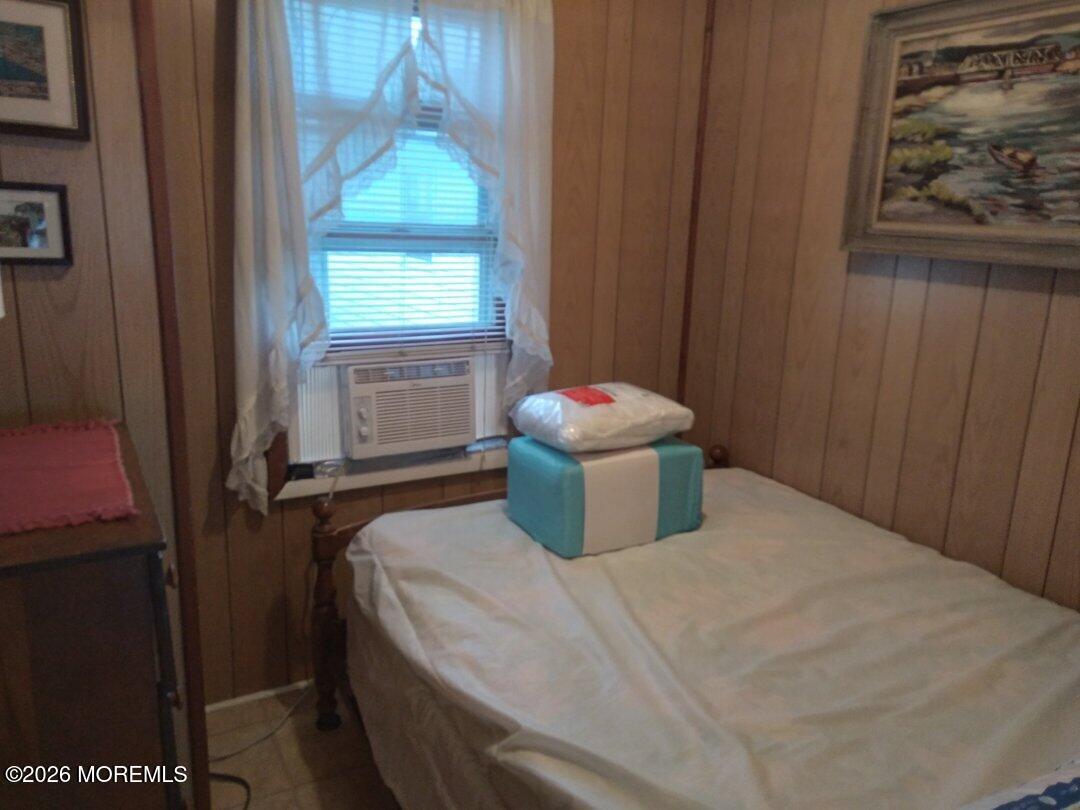 10 Lake Street Point Pleasant Beach, NJ 08742 - Photo 4 of 20 a bedroom with a bed and a window