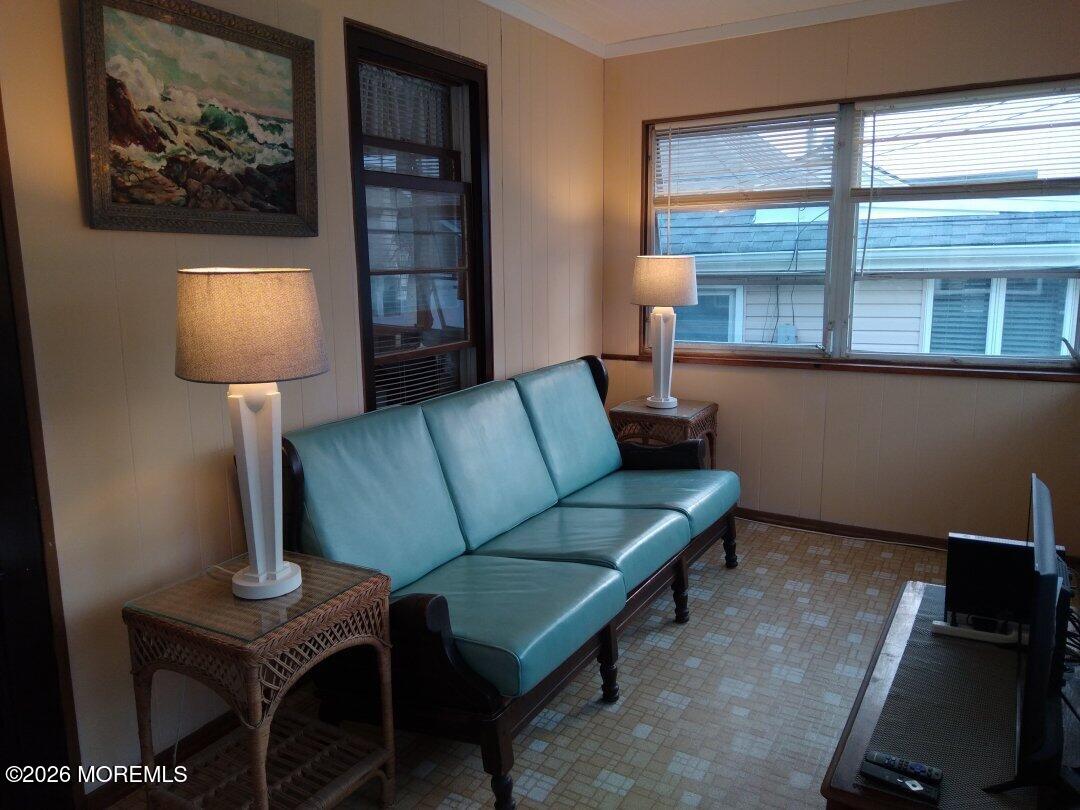10 Lake Street Point Pleasant Beach, NJ 08742 - Photo 6 of 20 a living room with furniture a lamp and a window