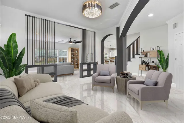 a living room with furniture and a large window