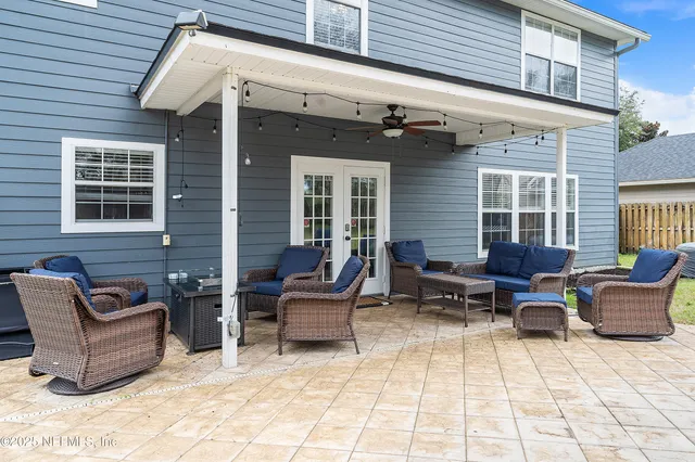 a backyard of a house with outdoor seating