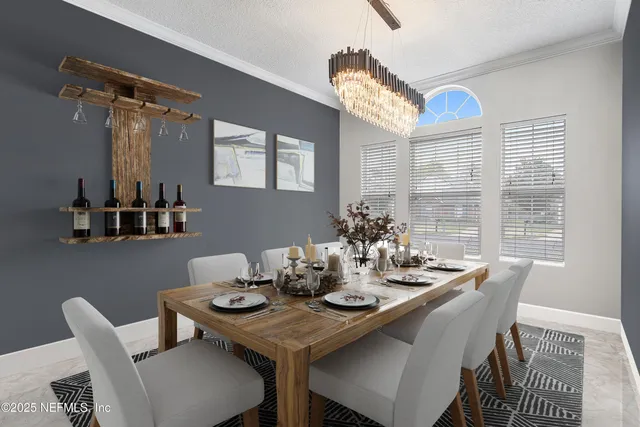 a view of a dining room with furniture window and outside view