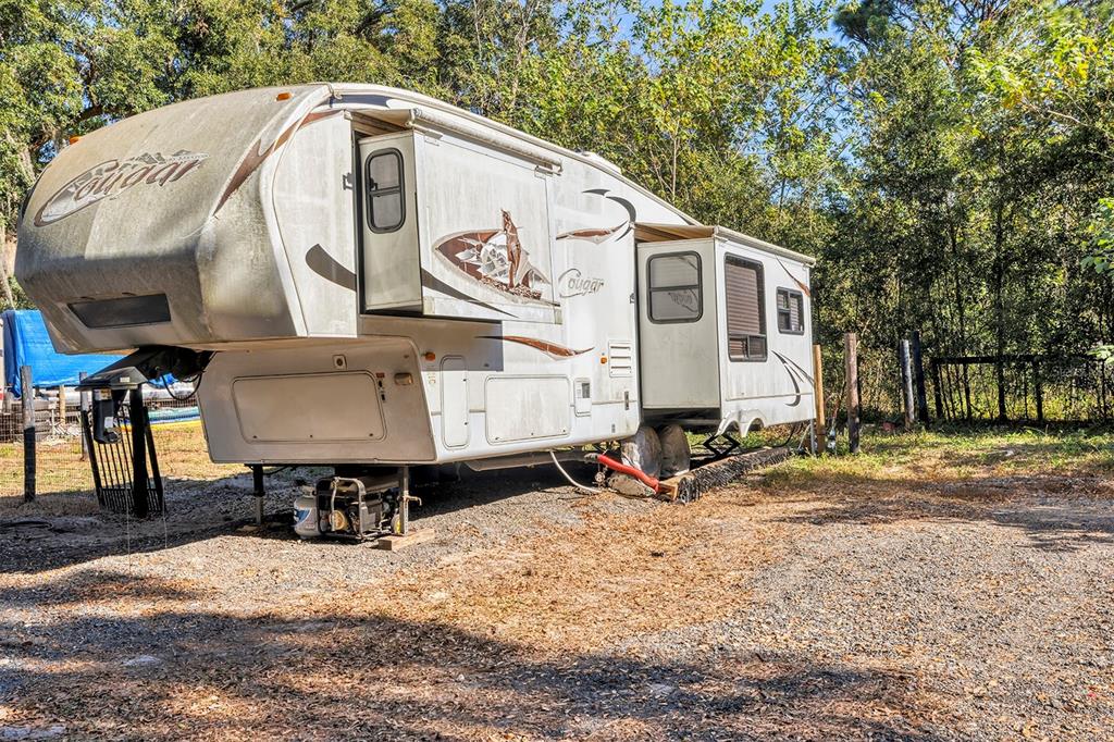 208 Northeast 70th Street Ocala, FL 34475 - Photo 16 of 71 a view of a back yard of the house