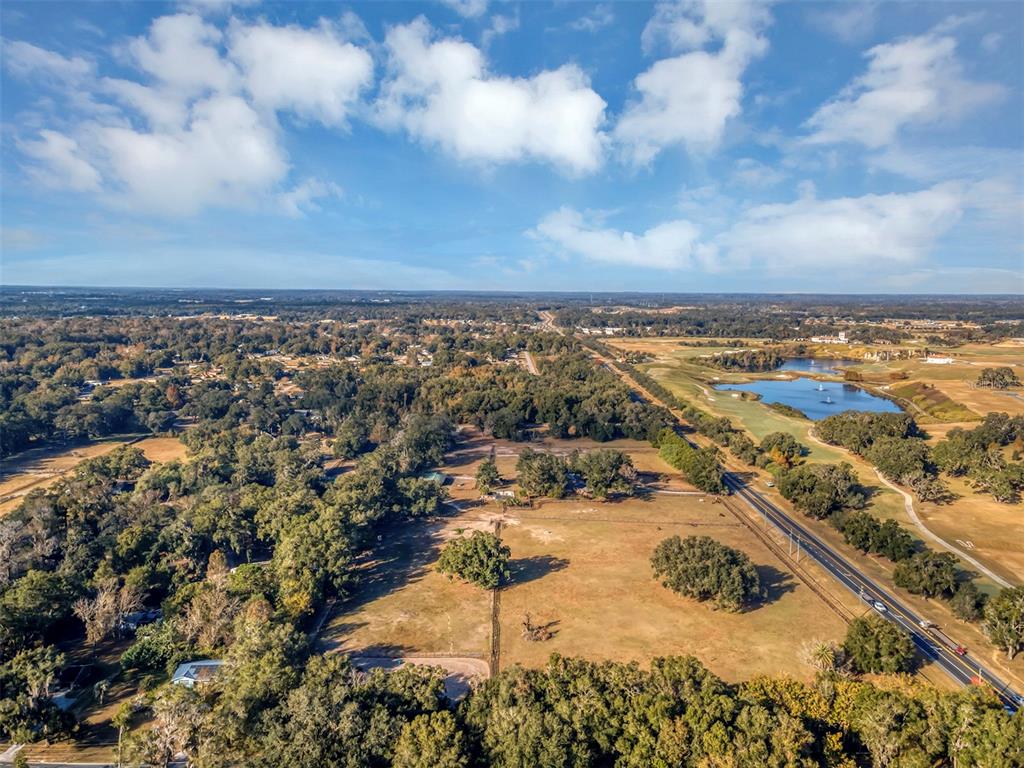 208 Northeast 70th Street Ocala, FL 34475 - Photo 68 of 71 an aerial view of residential building and trees around